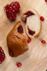Fresh soft wheat bun with red cherry jam