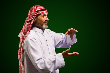  Arab sorcerer forming energy ball with his hands, performs mystical ritual. Mystical and...