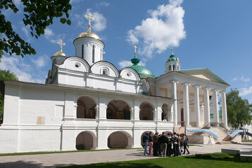 Schoolchildren on an excursion to the Spaso-Preobrazhensky Monastery near the walls of the Spaso-Preobrazhensky Cathedral and the Church of the Yaroslavl Miracle Workers. Yaroslavl, Russia