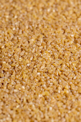 Fresh wheat porridge but cooked scattered on the table