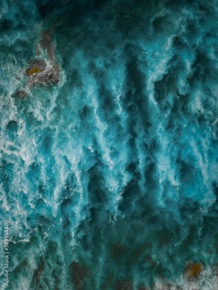 Wall mural View from above, stunning aerial view of a Of a beautiful blue sea that forms a natural background. - Wall murals