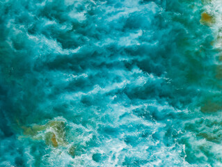 View from above, stunning aerial view of a Of a beautiful blue sea that forms a natural background.