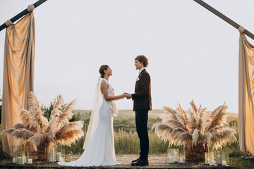 Bride and groom on their wedding ceremony