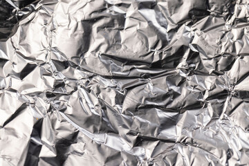 old used crumpled aluminum foil , close up