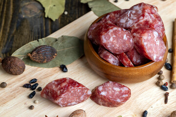 Dried pork sausage during slicing