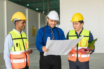 Construction engineers discussion with architects at construction site or building site.
