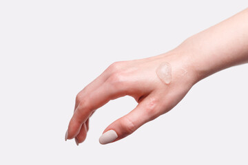 Woman Back of the Hand with Sample of Oxygen Moisturizing Gel, isolated on white