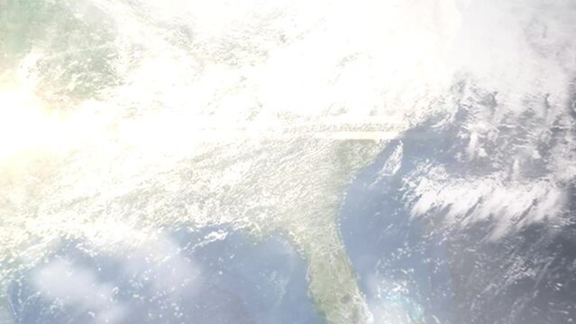 Earth zoom in from outer space to city. Zooming on Macon, Georgia, USA. The animation continues by zoom out through clouds and atmosphere into space. Images from NASA