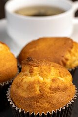 Soft and fresh fragrant wheat cupcake on a black stone