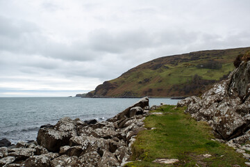 Fototapeta na wymiar Rocky coastline at Murlough Bay, Antrim, Northern Ireland
