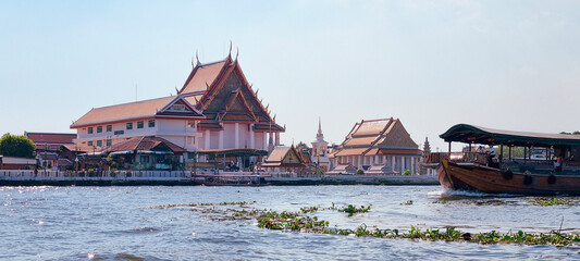 asian temple and boat on the river