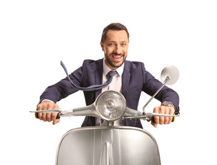 Businessman riding a silver scooter and smiling
