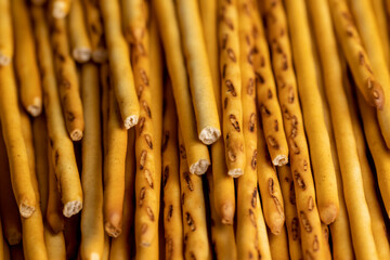 Thin and long bread sticks made of wheat flour on the table
