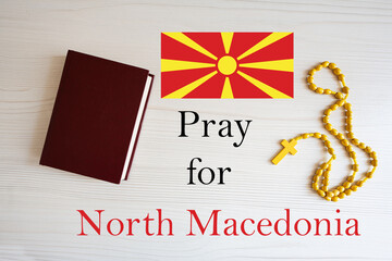 Pray for North Macedonia. Rosary and Holy Bible background.