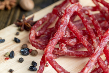 Dried veal sausage during slicing