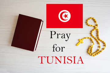 Pray for Tunisia. Rosary and Holy Bible background.