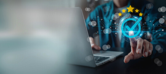Businessman working on computer and showing the sign top Quality Assurance Standard Assurance ISO...