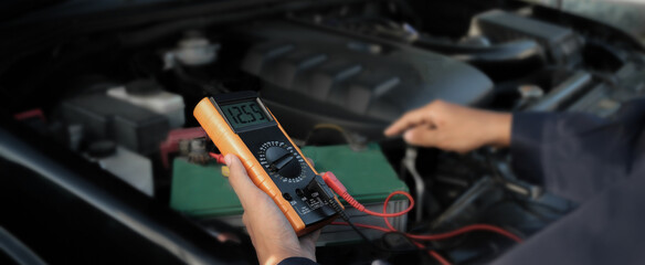 Technician checking the electrical system of the car