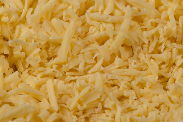 Hard cheese with holes grated into thin small slices