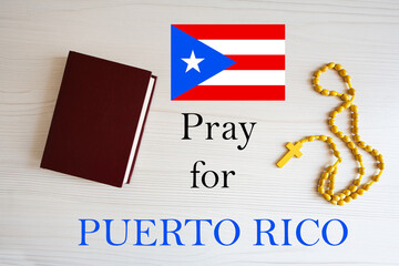 Pray for Puerto Rico. Rosary and Holy Bible background.