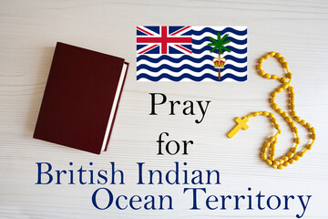 Pray for British Indian Ocean Territory. Rosary and Holy Bible background.