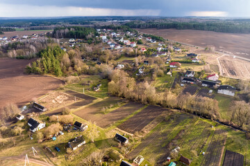 Fototapeta premium panoramic aerial view of private development with country houses or village