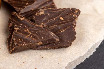 a crumbled piece of bitter chocolate into small pieces