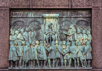 Copenhagen, Denmark - September 13, 2010:  Christian III confirmed the Reformation of Denmark green bronze relief on front Reformation Memorial obelisk at bispetorv square