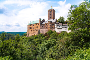 View of the Wartburg from outside and the Thuringer forest in the background, Eisenach, Germany