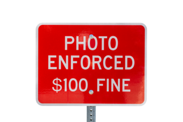 Photo enforced $100 fine warning sign isolated with cut out background.