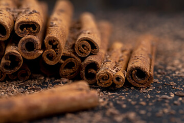 solid aromatic cinnamon on the table in chocolate