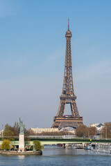 Fototapeta na wymiar Paris, France - 04 05 2023: View of the Statue of Liberty, Grenelle bridge from Mirabeau Bridge.