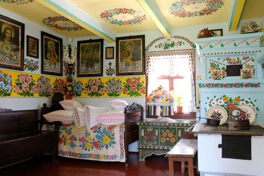 Zalipie, Poland - circle June, 2020: Interior of houses in famous polish village Zalipie with traditional hand painted floral decorations on old wooden houses and various items