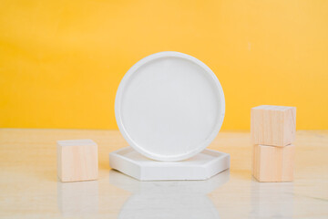 Cylindrical podium with wooden cubes for branding and packaging presentation. Beauty product concept.