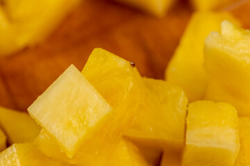 sliced pulp of peeled ripe pineapple , close up