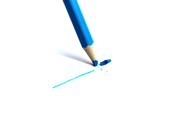 A blue pencil wrote on a white background and broke.