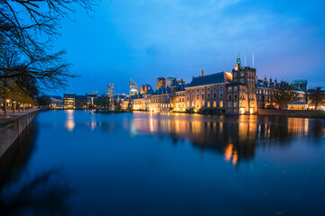 Hofvijver or Buitenhof, the dutch government headquarter with the skyline of the Hague at night