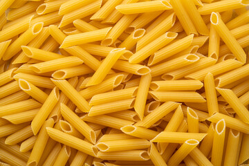 uncooked Penne rigate pasta for background.Top view