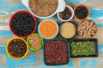 assorted bowls with raw grain and seeds top view