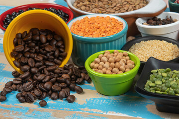 assorted bowls with raw grain and seeds top view