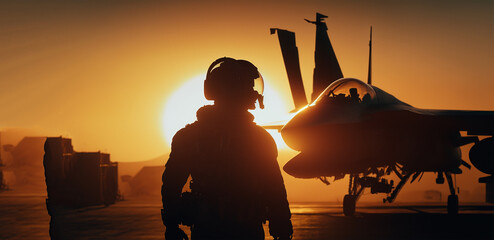 soldier in a shed at sunset. Military pilots near jet fighter at sunset. Military aviation. - obrazy, fototapety, plakaty