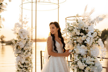 bride against the background of a yellow sunset