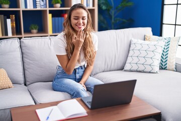 Young beautiful hispanic woman having video call communicate with sign deaf language at home © Krakenimages.com