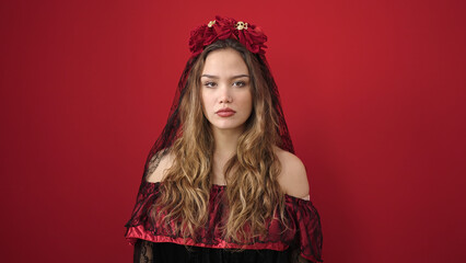 Young beautiful hispanic woman wearing katrina costume with relaxed expression over isolated red background