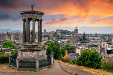 Aerial view of the town and castle  of  Edinburgh with Dugald Stewart monument in Scotland at sunset