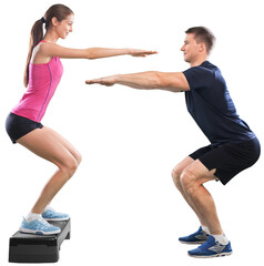 Young couple training together  on white background