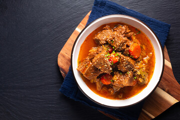 Food concept Korean spicy Beef stew on black background with copy space