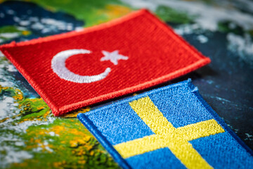 Turkey and Sweden flags. The concept of mutual relations between the countries, Turkey's veto...