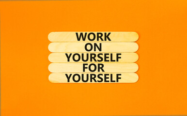 Work for yourself symbol. Concept words Work on yourself for yourself on wooden stick. Beautiful orange table orange background. Business and work for yourself concept. Copy space.