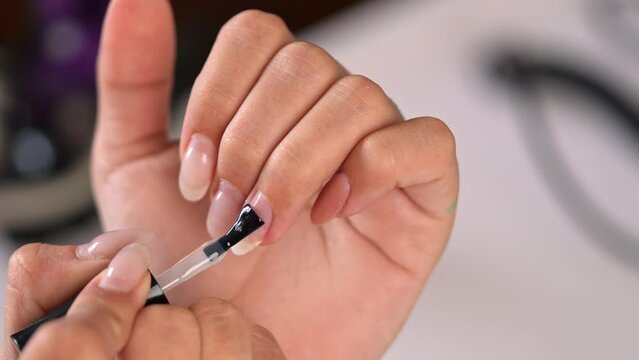 Close up woman doing manicure